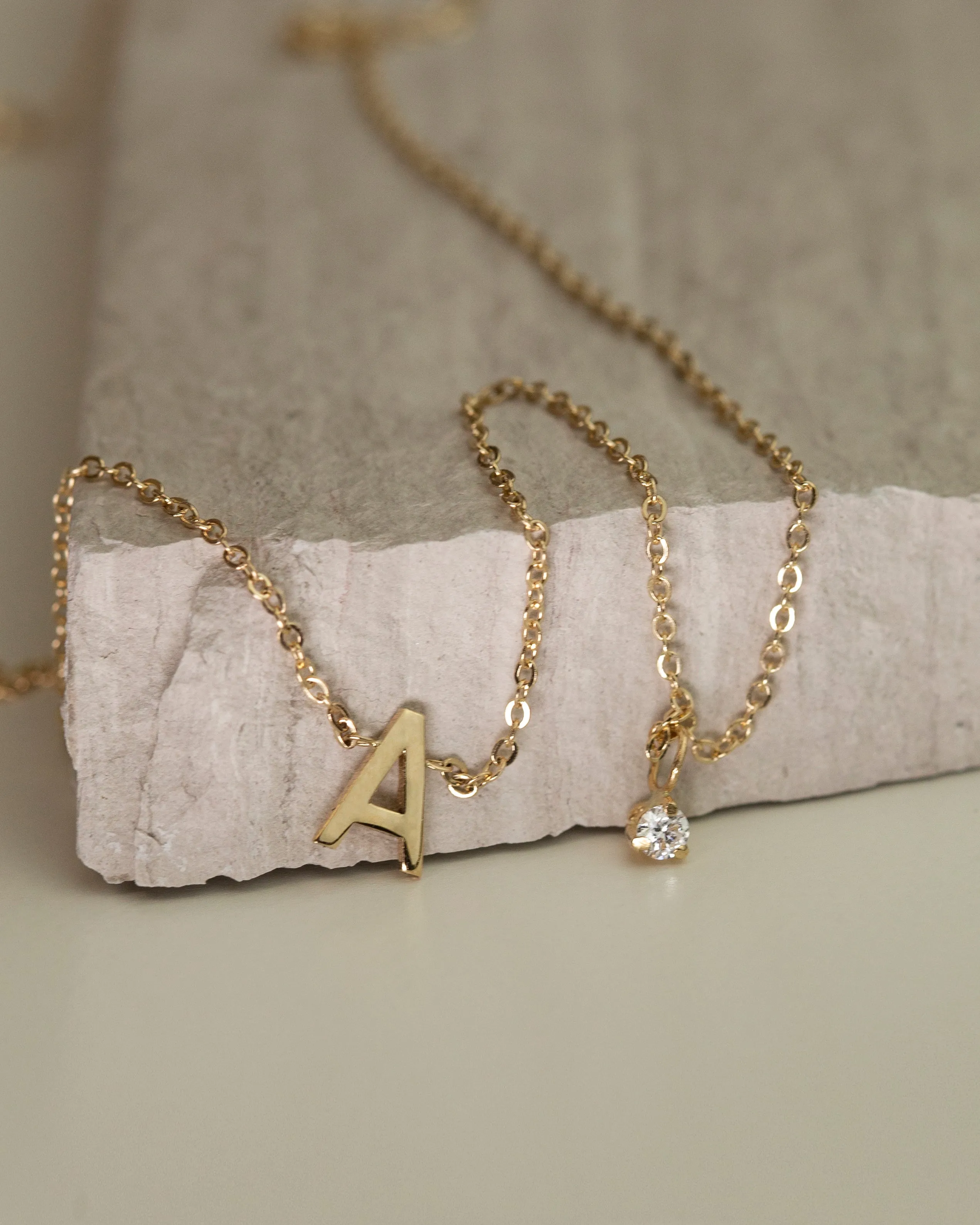 14k gold initial necklace with small side diamond dangle