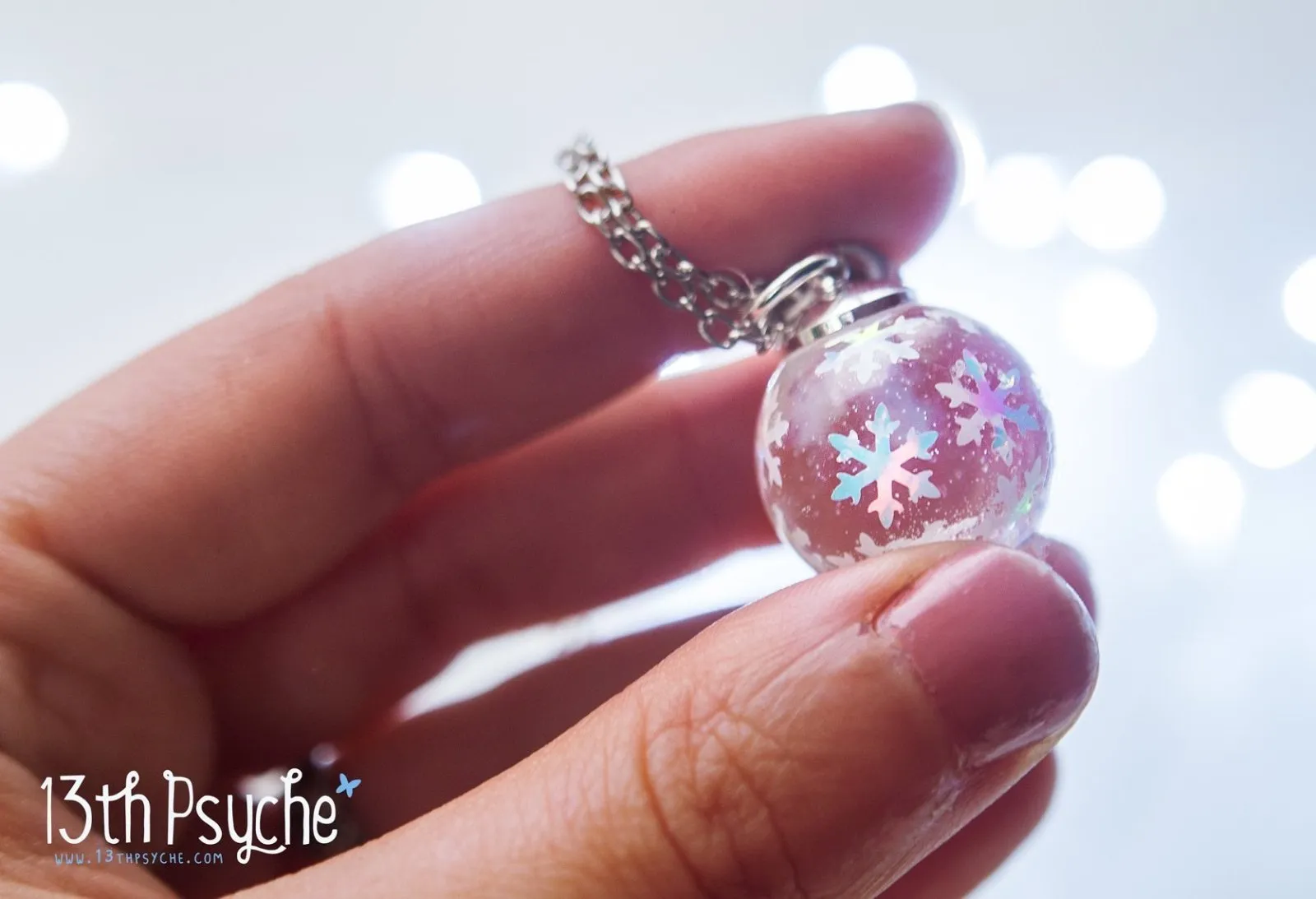 Winter inspired snowflake resin ball necklace