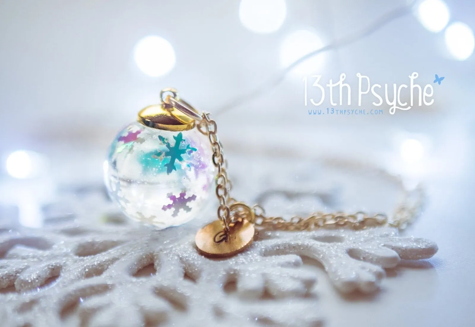 Winter inspired snowflake resin ball necklace