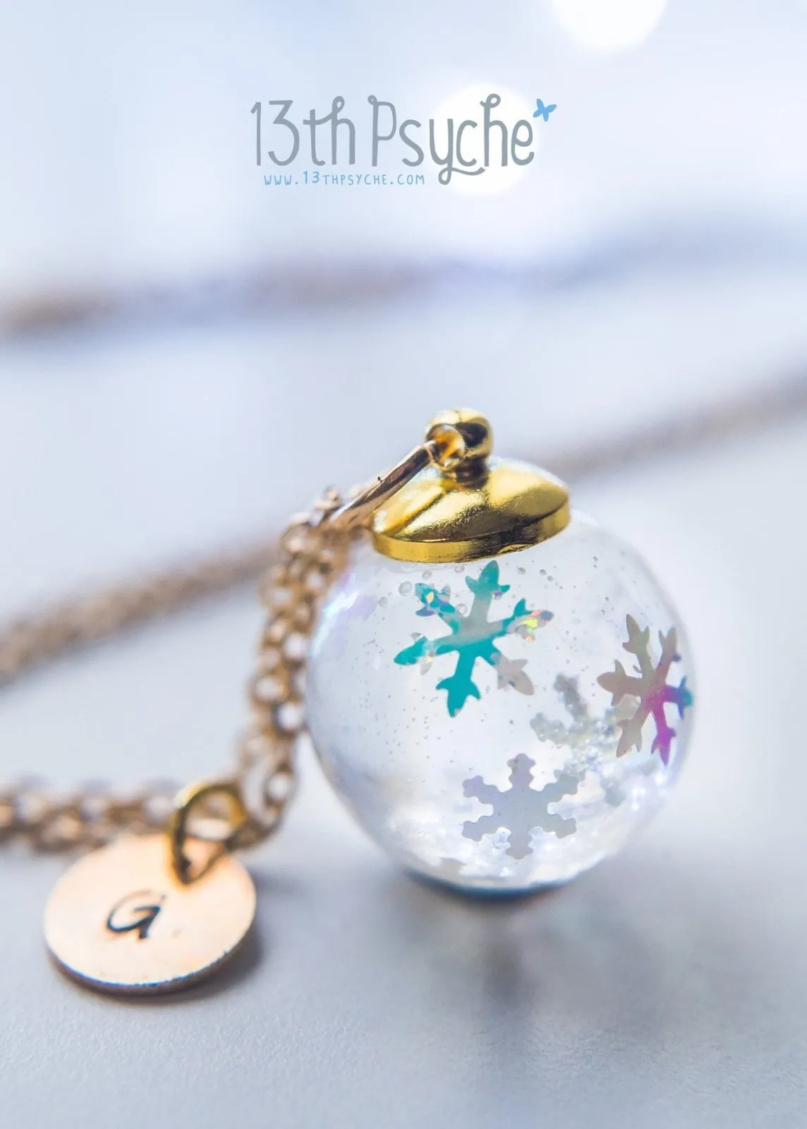 Winter inspired snowflake resin ball necklace